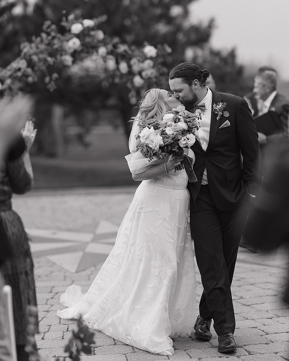 Bride and groom holding hands during ceremony at Fox Harb’r Resort Nova Scotia