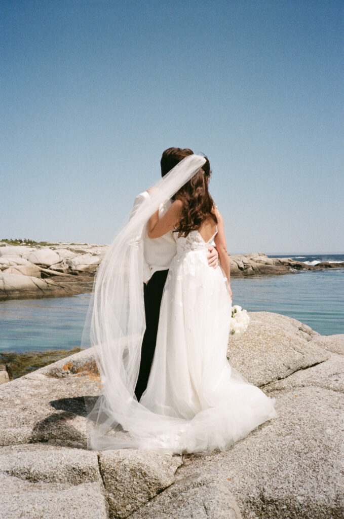 Wedding portraits at Peggy’s Cove lighthouse during Oceanstone Resort wedding