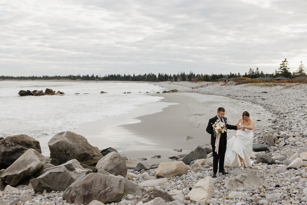 Bride and groom portraits on the beach at White Point Beach Resort