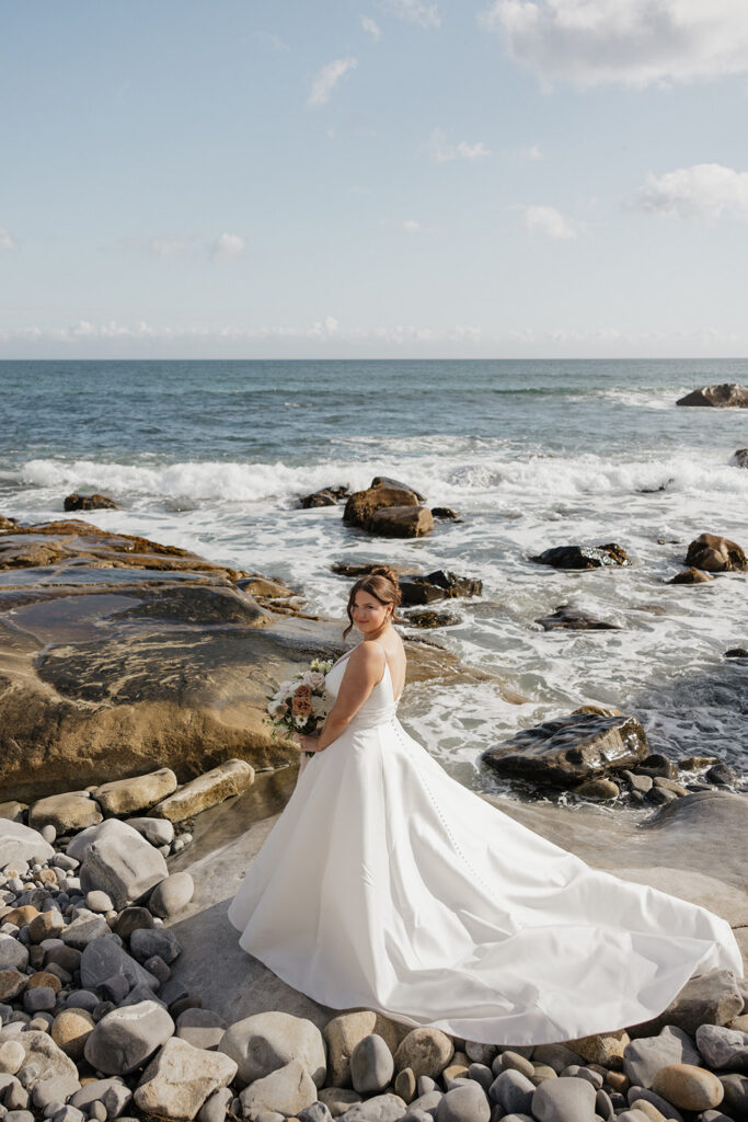 Bride and groom portraits on the beach at White Point Beach Resort