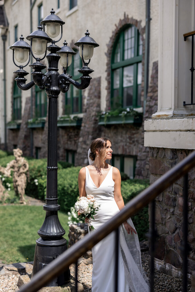 Bride walking through lush greenery at a private estate wedding in Nova Scotia