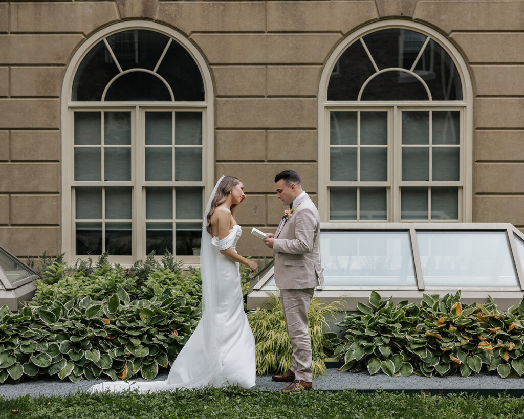 Bride walking through lush greenery at a private estate wedding in Nova Scotia