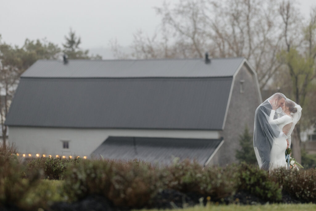 Bride and groom portraits along the rocky coastline at a Nova Scotia wedding venue