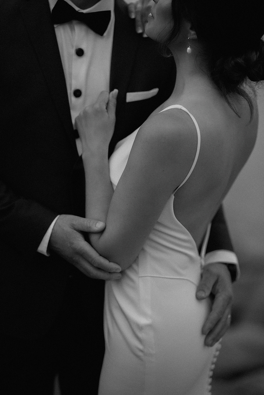 Couple embracing at sunset during a coastal Nova Scotia wedding