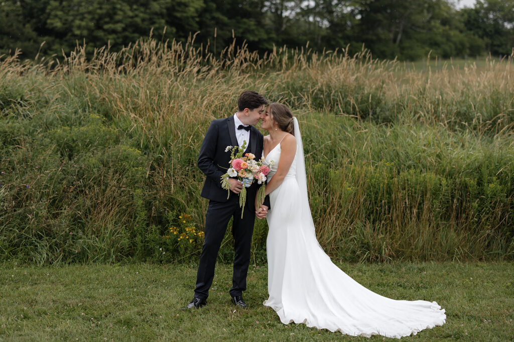 Bride and groom portraits overlooking the South Shore at Farm at South Cove