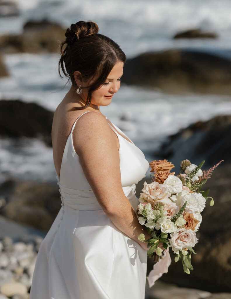 Bride and groom portraits on the beach at White Point Beach Resort