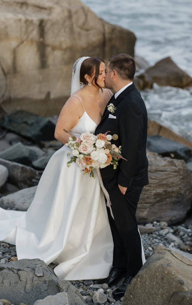 Bride and groom portraits on the beach at White Point Beach Resort