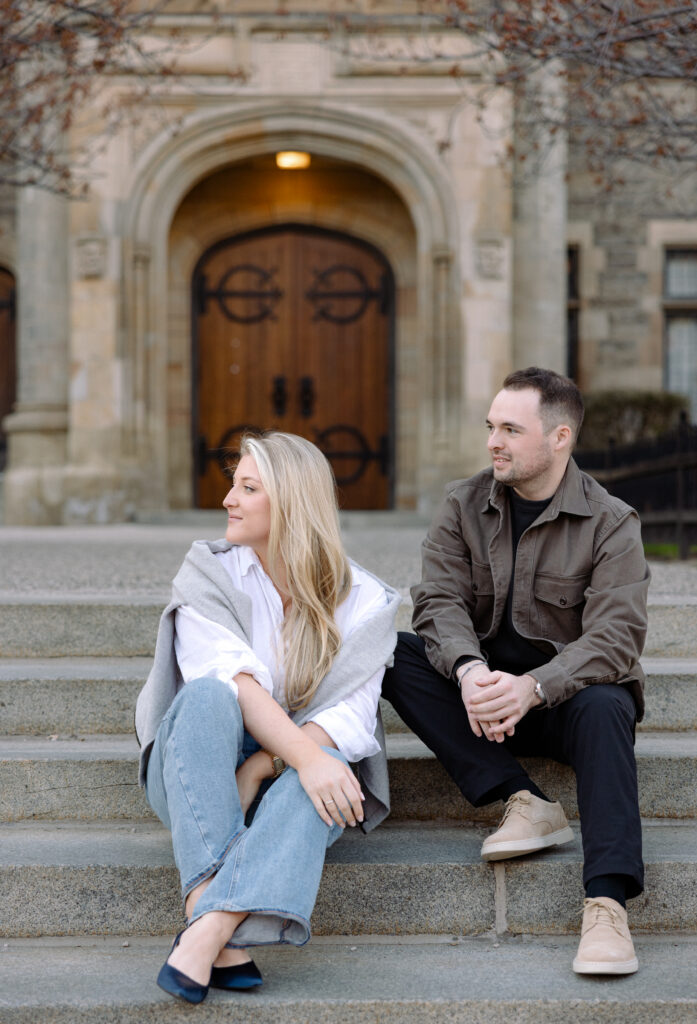 Intimate engagement portrait with soft light and historic architecture at University of Toronto