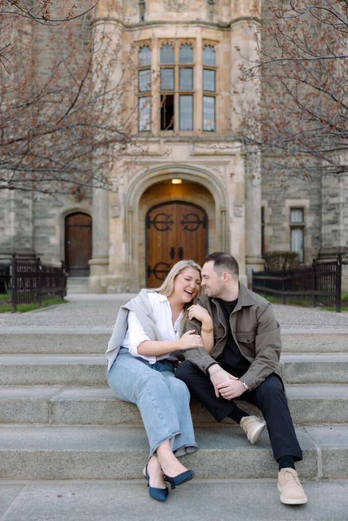 Intimate engagement portrait with soft light and historic architecture at University of Toronto