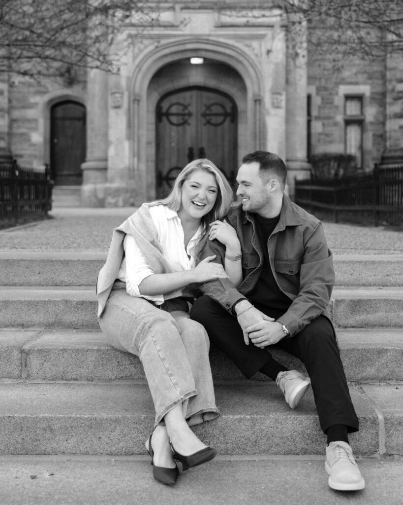 Intimate engagement portrait with soft light and historic architecture at University of Toronto