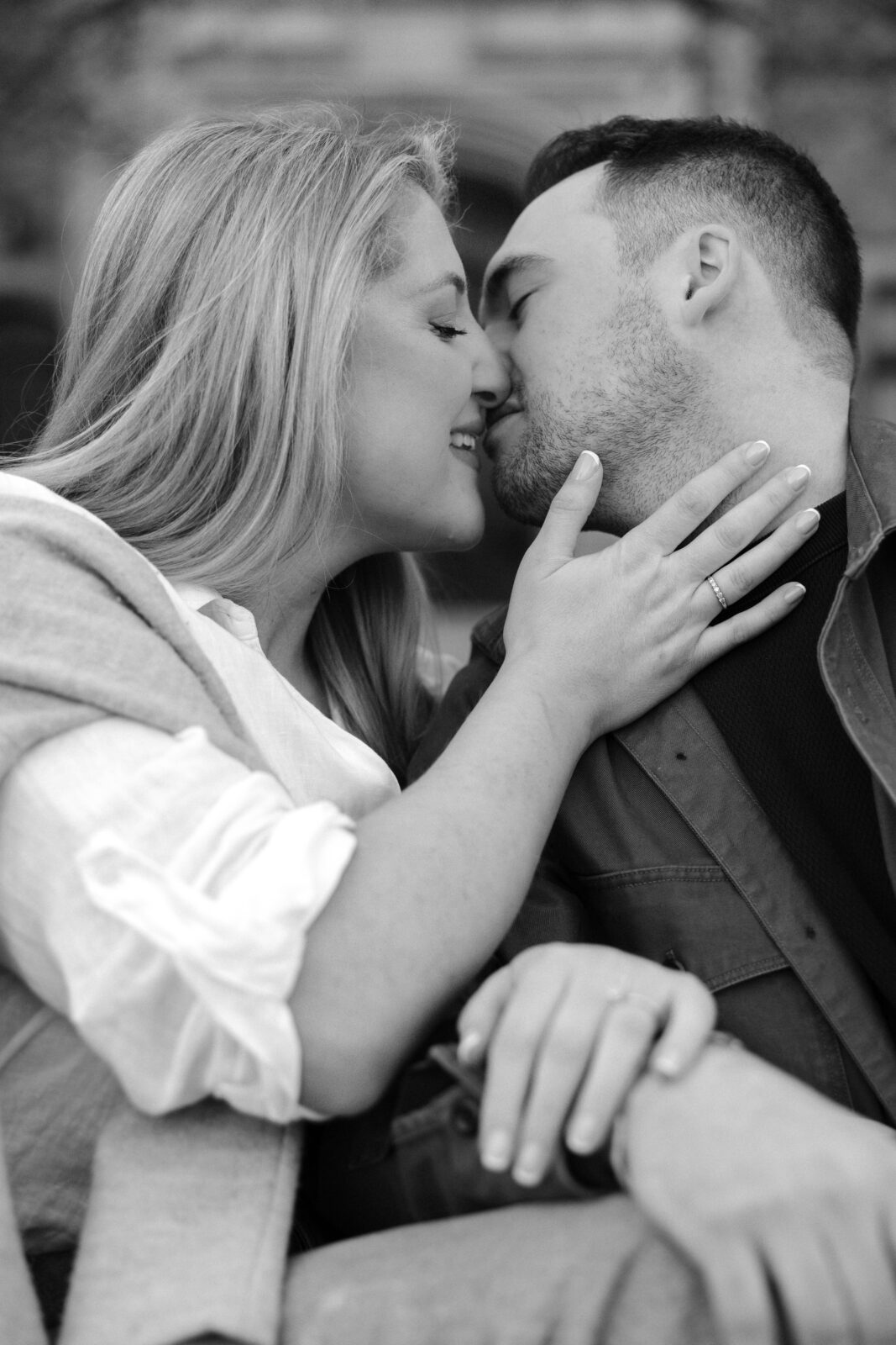 Intimate engagement portrait with soft light and historic architecture at University of Toronto