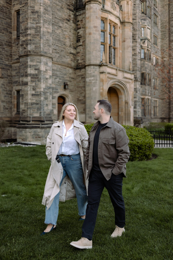 Intimate engagement portrait with soft light and historic architecture at University of Toronto