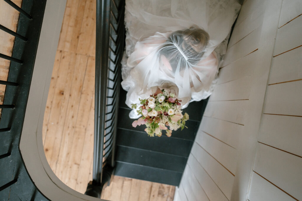 Wedding editorial scene inside a 1896 farmhouse in Grand Pré